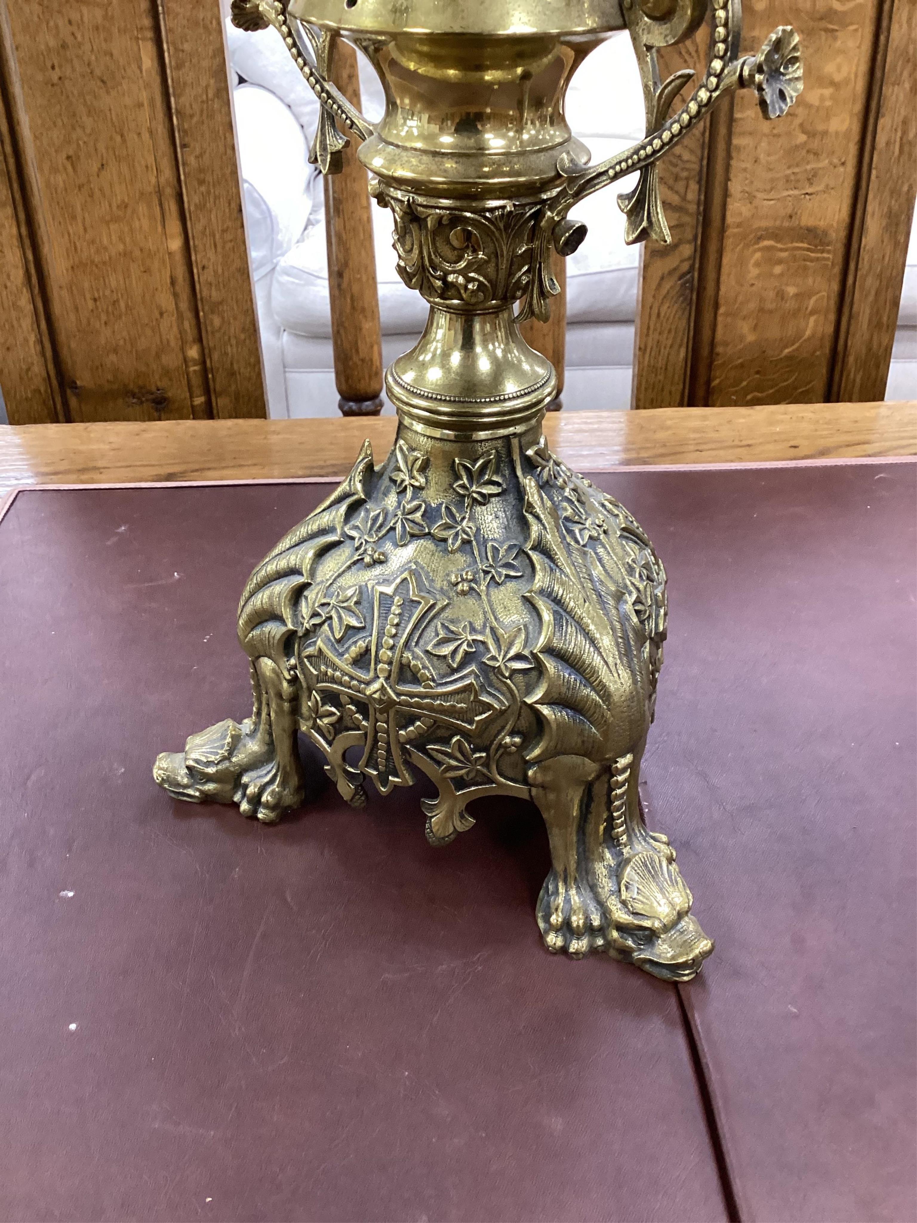 A pair of ornate French floral seven branch, brass church candelabra, 99cm high